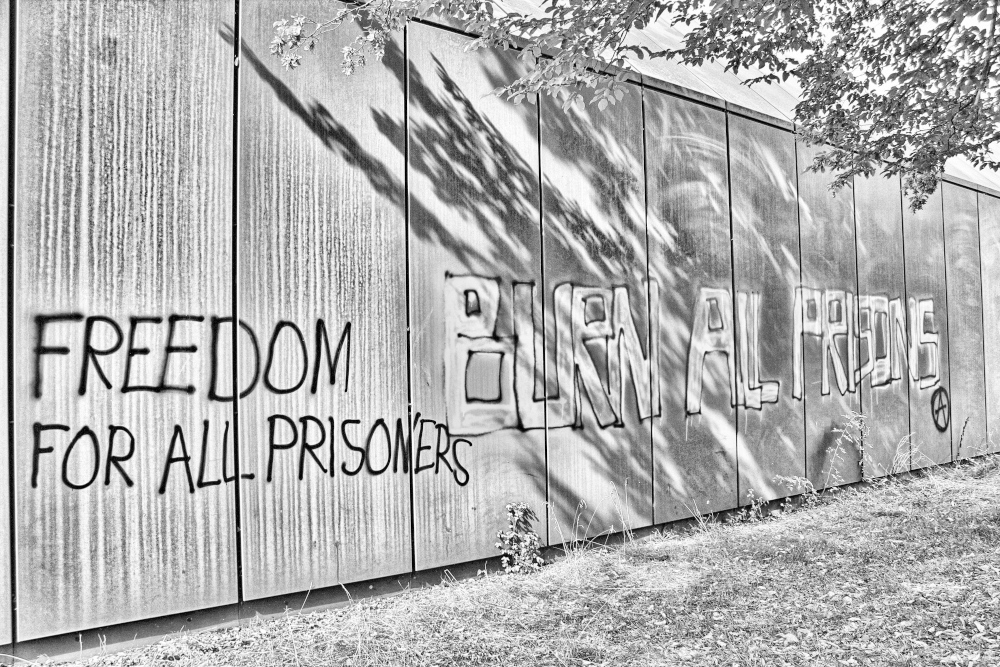 Graffiti "Burn all Prisons" and "Freedom for all Prisoners"